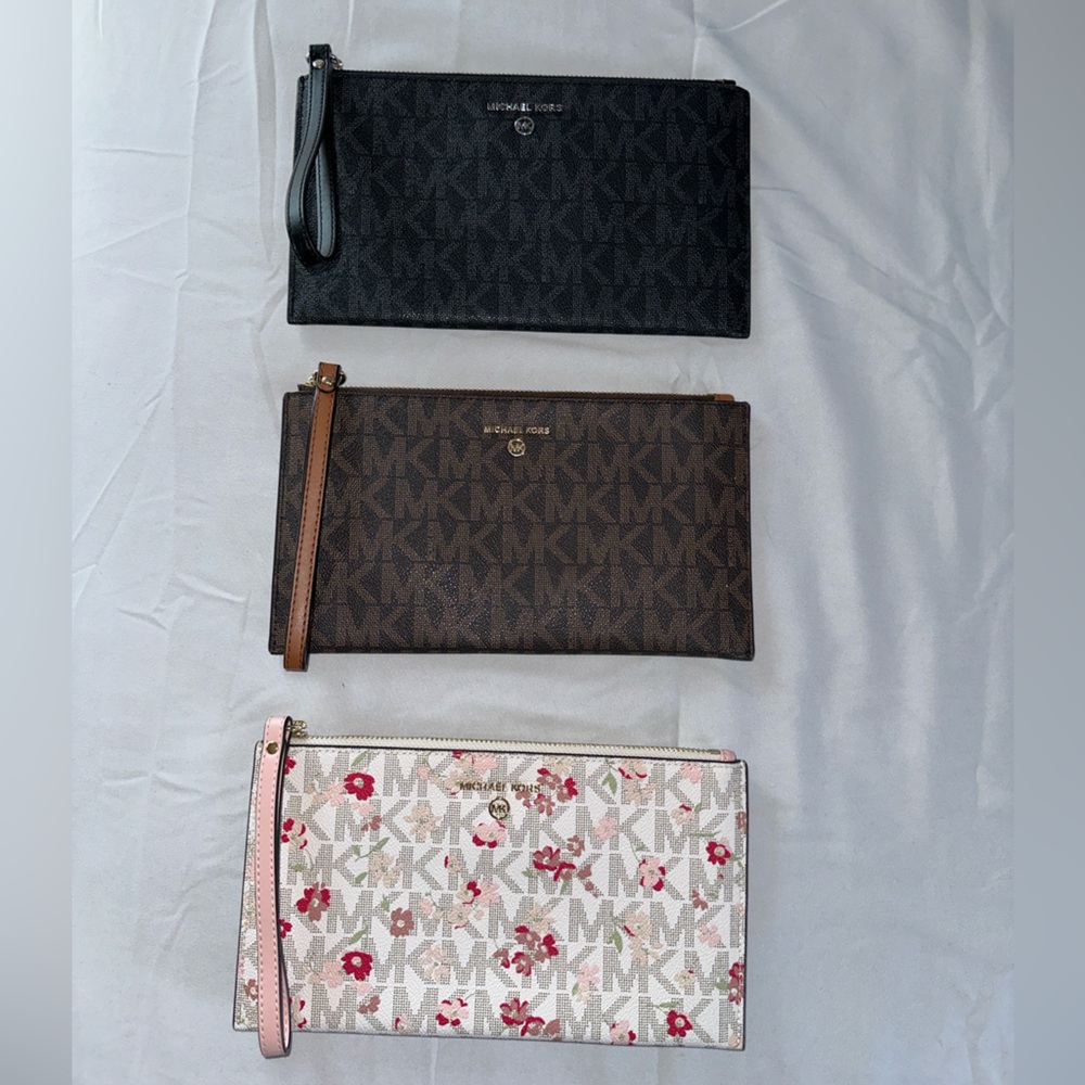Assorted authentic Michael Kors wristlets and wallets